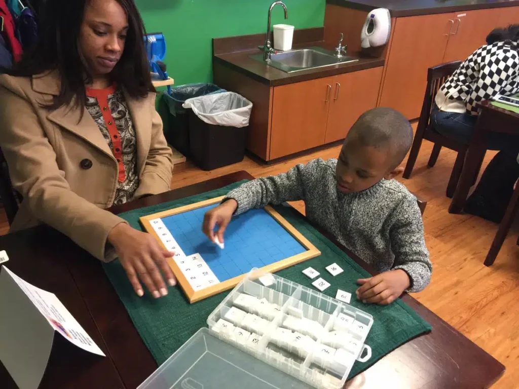 child placing letters